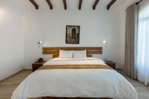 Ein Bett oder Betten in einem Zimmer der Unterkunft Aya Sophia Villa Garden Hotel