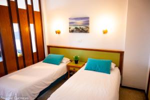 A bed or beds in a room at Brisamar Canteras