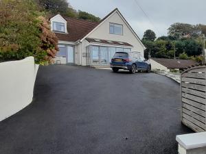 a car parked in the driveway of a house at The Nook @ Drop Anchor in Portishead