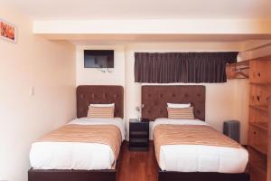 Postel nebo postele na pokoji v ubytování Hotel Las Quenas + 37 fotografií