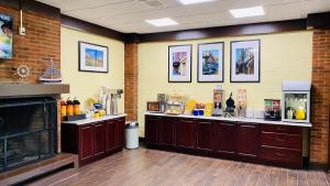 a large kitchen with a counter and a foodcourt at Days Inn by Wyndham Maysville Kentucky in Maysville