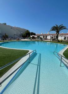 a large swimming pool with blue water at Malibu Park 3078 - Ocean View Studio in Adeje