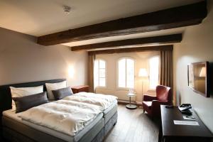 Postel nebo postele na pokoji v ubytování Hotel Anno 1216