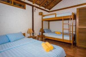 Postel nebo postele na pokoji v ubytování Hosteria La Terraza