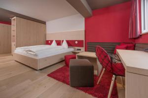 Postel nebo postele na pokoji v ubytování Familotel Alphotel