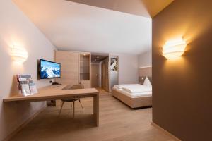 Postel nebo postele na pokoji v ubytování Familotel Alphotel
