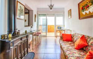 a living room with a couch and a kitchen at Awesome Apartment In Playa Honda With Kitchen in Playa Honda