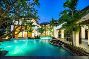 a swimming pool in the backyard of a villa at YiZen Boutique Phutara 5 Bedroom Villa in Nong Prue