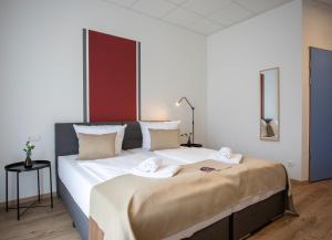 Postel nebo postele na pokoji v ubytování B Home Apart Hotel by Alpha