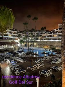 a parking lot with a bunch of parked bikes at MAXIMAR Apartment 8 bed places, heated swimmingpool in Arona