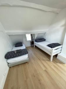 Posteľ alebo postele v izbe v ubytovaní LIKEHOME - Appartement cosy et calme proche Paris