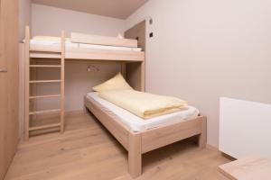 Postel nebo postele na pokoji v ubytování Familotel Alphotel