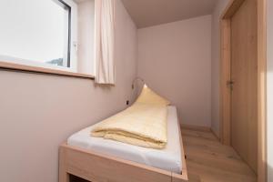 Postel nebo postele na pokoji v ubytování Familotel Alphotel
