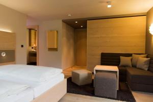 Postel nebo postele na pokoji v ubytování Familotel Alphotel