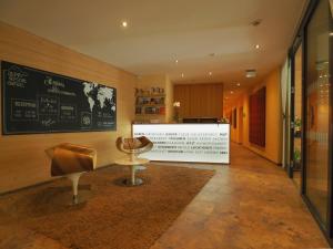 a room with a table and a chair on display at Aparthotel Alpinresort Damüls in Damuls