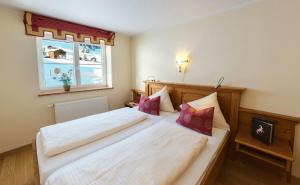 Postel nebo postele na pokoji v ubytování Familotel Alphotel