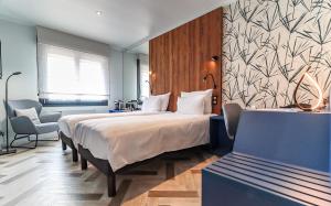 Postel nebo postele na pokoji v ubytování Logis Hôtel du Parc