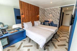 Postel nebo postele na pokoji v ubytování Logis Hôtel du Parc