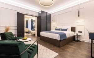 a bedroom with a bed and a living room at One Luxury Suites in Belgrade
