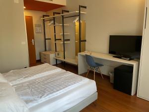 TV a/nebo společenská místnost v ubytování Hotel Al Caval