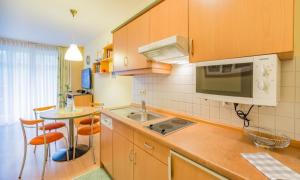 a kitchen with a sink and a counter top at Fewo B 34 Am Weststrand Toplage in Kühlungsborn