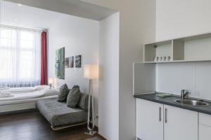 Postel nebo postele na pokoji v ubytování GLS Studio Hotel Berlin