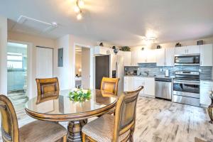 a kitchen with a dining room table and chairs at Turquoise Escape about 1 Mi to Sailfish Marina! in West Palm Beach