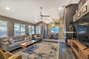 a living room with a couch and a table at Gorgeous Austin Getaway about 8 Mi to Downtown! in Austin