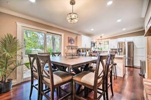 a kitchen and dining room with a table and chairs at Chic Fox River Grove Home with Great Location! in Fox River Grove