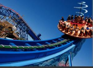 a group of people on a roller coaster at a carnival at Cheerful 2-bedroom home with off street parking in Blackpool