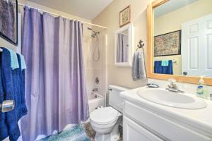 a bathroom with a toilet and a sink at Pet-Friendly Wilmington Home with Fenced Yard! in Wilmington