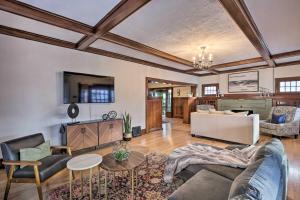 a living room with a couch and a table at El Paso Historic Craftsman House Less Than 1 Mi to Dtwn! in El Paso