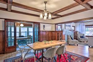 a dining room with a wooden table and chairs at El Paso Historic Craftsman House Less Than 1 Mi to Dtwn! in El Paso