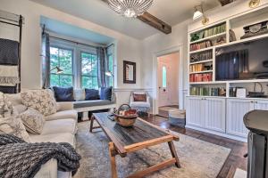 a living room with a couch and a table at Picturesque Jefferson Abode with On-Site Pond! in Jefferson