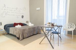 A bed or beds in a room at Neapolitan Style Apartrment