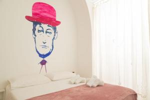 A bed or beds in a room at Neapolitan Style Apartrment