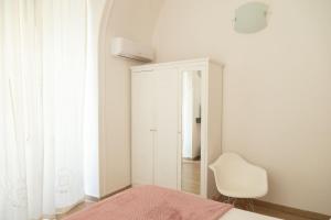 A bed or beds in a room at Neapolitan Style Apartrment