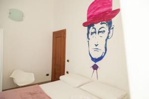 A bed or beds in a room at Neapolitan Style Apartrment
