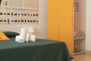 A bed or beds in a room at Neapolitan Style Apartrment