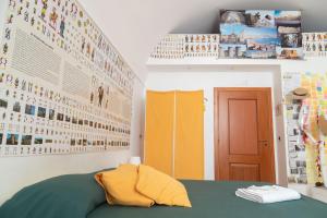 A bed or beds in a room at Neapolitan Style Apartrment