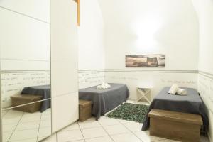 A bed or beds in a room at Neapolitan Style Apartrment