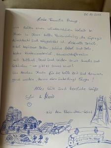 een pagina van een boek met een handgeschreven brief bij Villa Nevada - Adults only in Bad Schandau