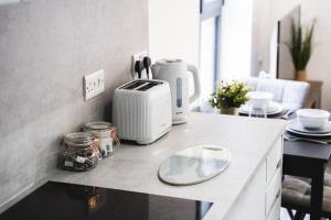 a kitchen with a counter with a toaster on it at Central Studio - New - FREE Wi-Fi - City Centre in Sheffield