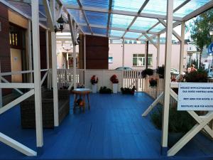 arium of a building with a blue floor at Hostel Annamarie in Szczecin