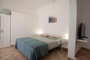 Postel nebo postele na pokoji v ubytování Wohnung Esterlizia
