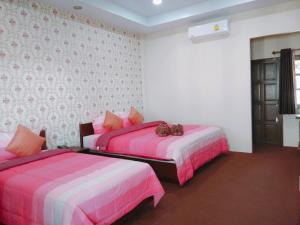 Postel nebo postele na pokoji v ubytování Samui platinum hotel