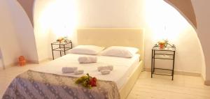 A bed or beds in a room at Guglielmo Tell Suite