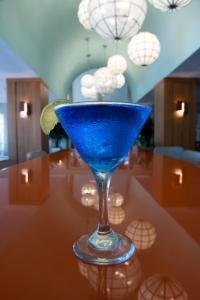 a blue drink sitting on top of a table at Bluegreen's Bayside Resort and Spa at Panama City Beach in Panama City Beach