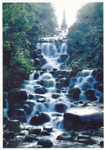 a stream of water cascading down a rocky road at Mehringdamm in Berlin