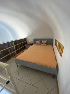 A bed or beds in a room at Casa Catania Inn